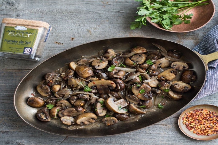 meat with mushrooms in pan